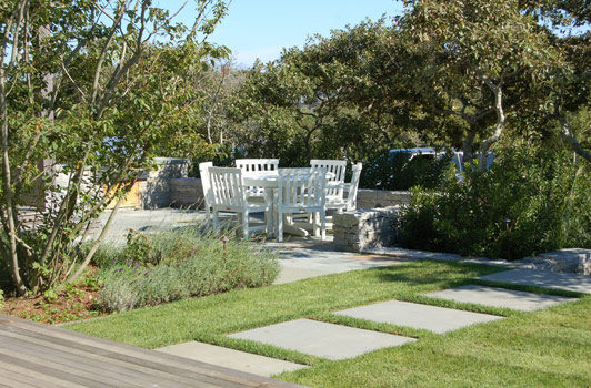 title:A culinary herb garden was established adjacent the outdoor kitchen/grilling area.