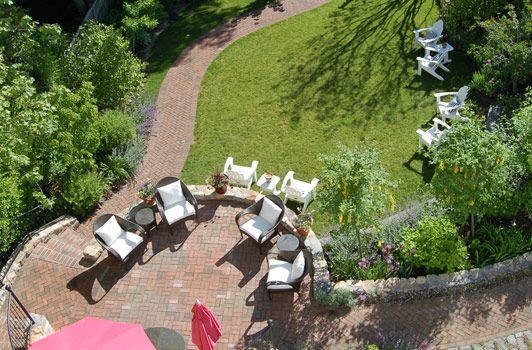 title:Looking at the garden and terraces from one of the highest verandas, one can see the playfulness of the garden layout, as well as begin to appreciate the layering of levels.